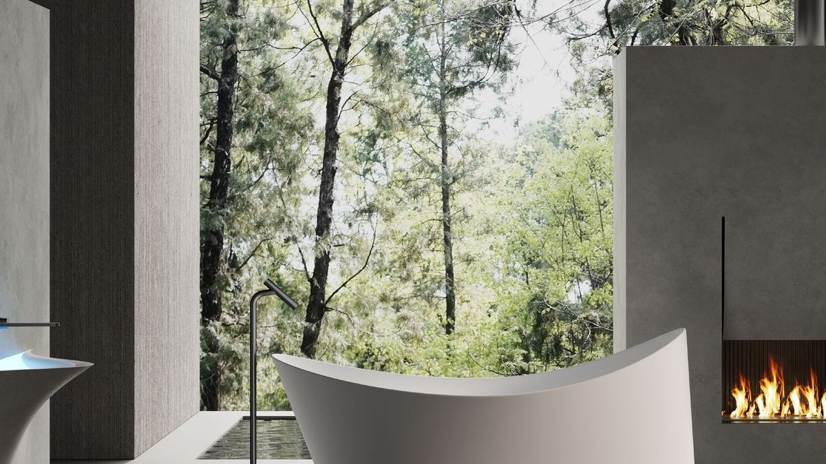 A freestanding solid surface bathtub in a residential bathroom