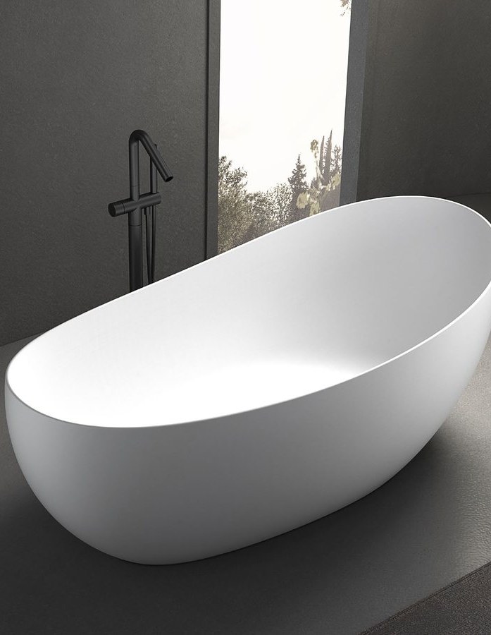 An oval freestanding solid surface bathtub