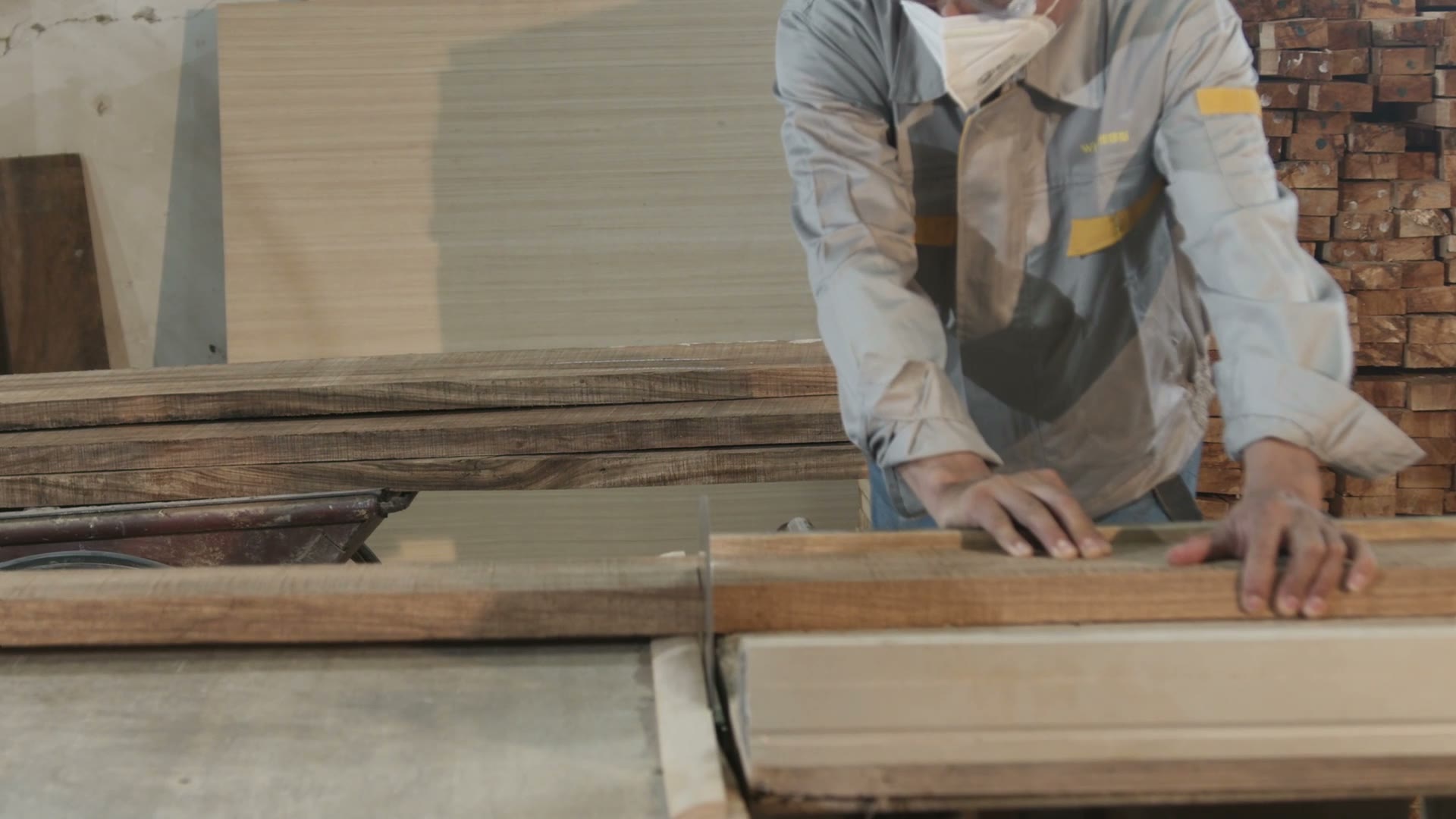 Factory worker preparing timber stock for bathroom vanity production