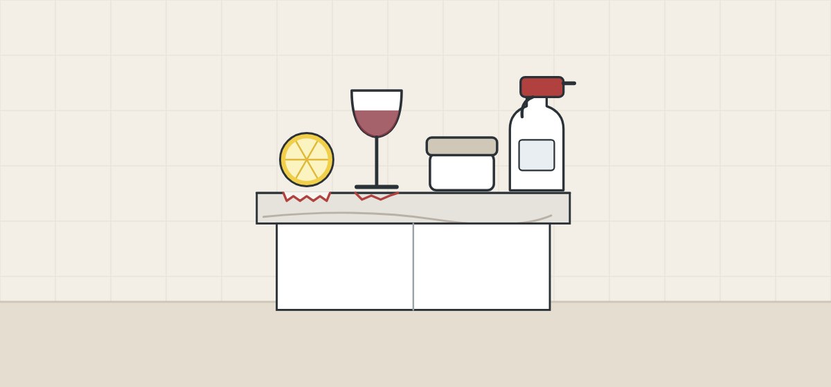 Illustration of a stone top carrying a lemon slice, a glass of wine, a cosmetics jar and a spray cleaner, with the surface roughened under the lemon and the glass