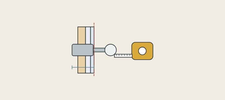 Illustration: a wall in section with a valve body, a dashed line at the finished surface, a depth mark and a tape measure