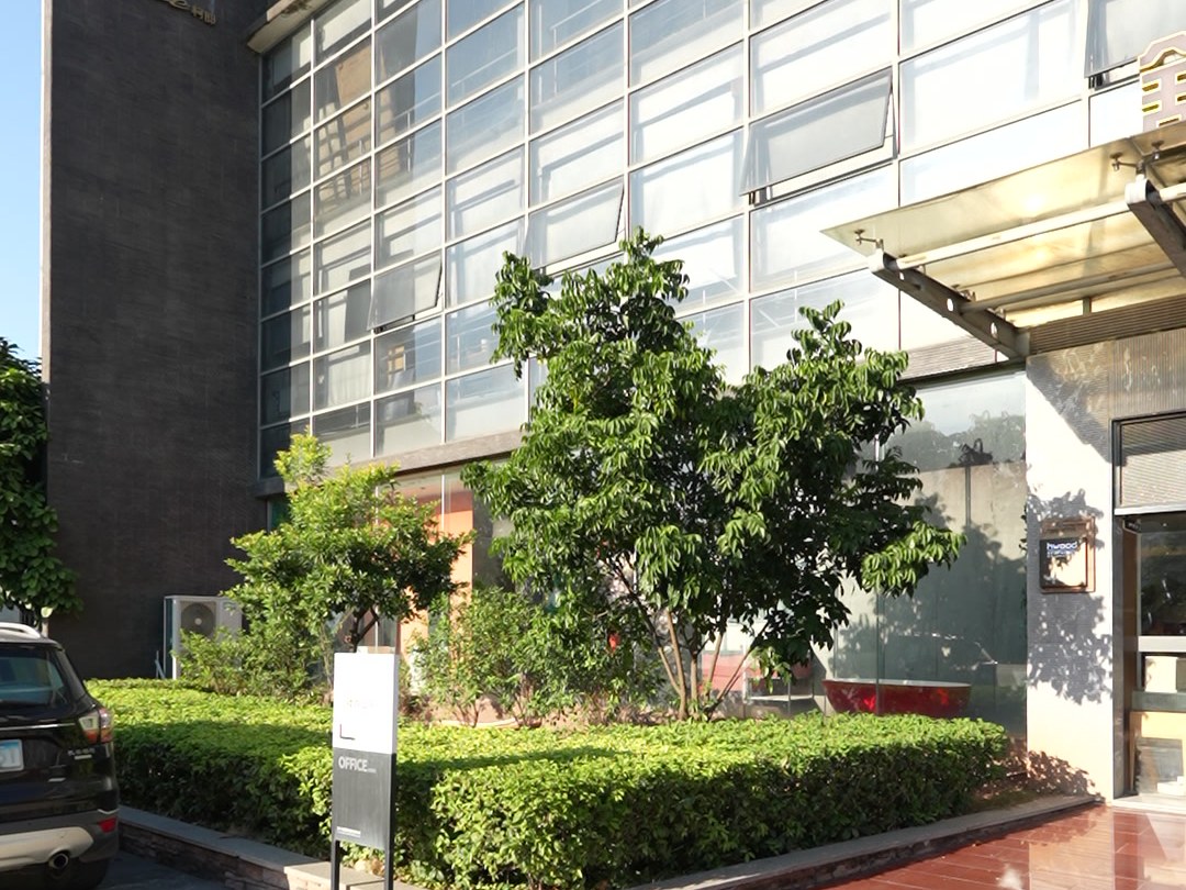 The glass-fronted exterior of the WNS production base