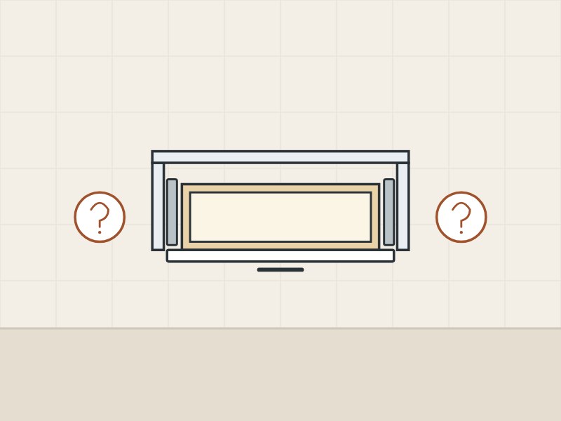 Illustration of a wide, shallow drawer seen from above between two question marks