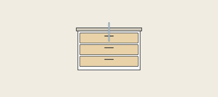 Illustration: a three-drawer vanity front with a supply pipe entering from above