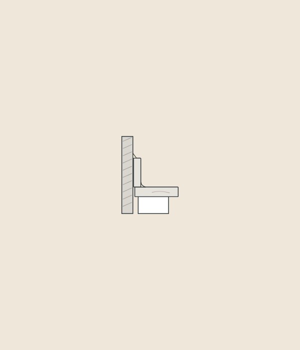 Illustration of a backsplash strip standing on a vanity top against a wall, seen in section with sealant in the corner