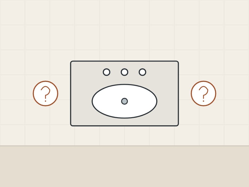 Illustration of a vanity top with three faucet holes between two question marks