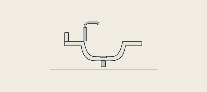 Illustration: a one-piece vanity top in section with an integrated bowl, a waste outlet and a faucet