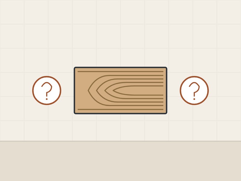 Illustration of a cathedral-grain veneer leaf between two question marks