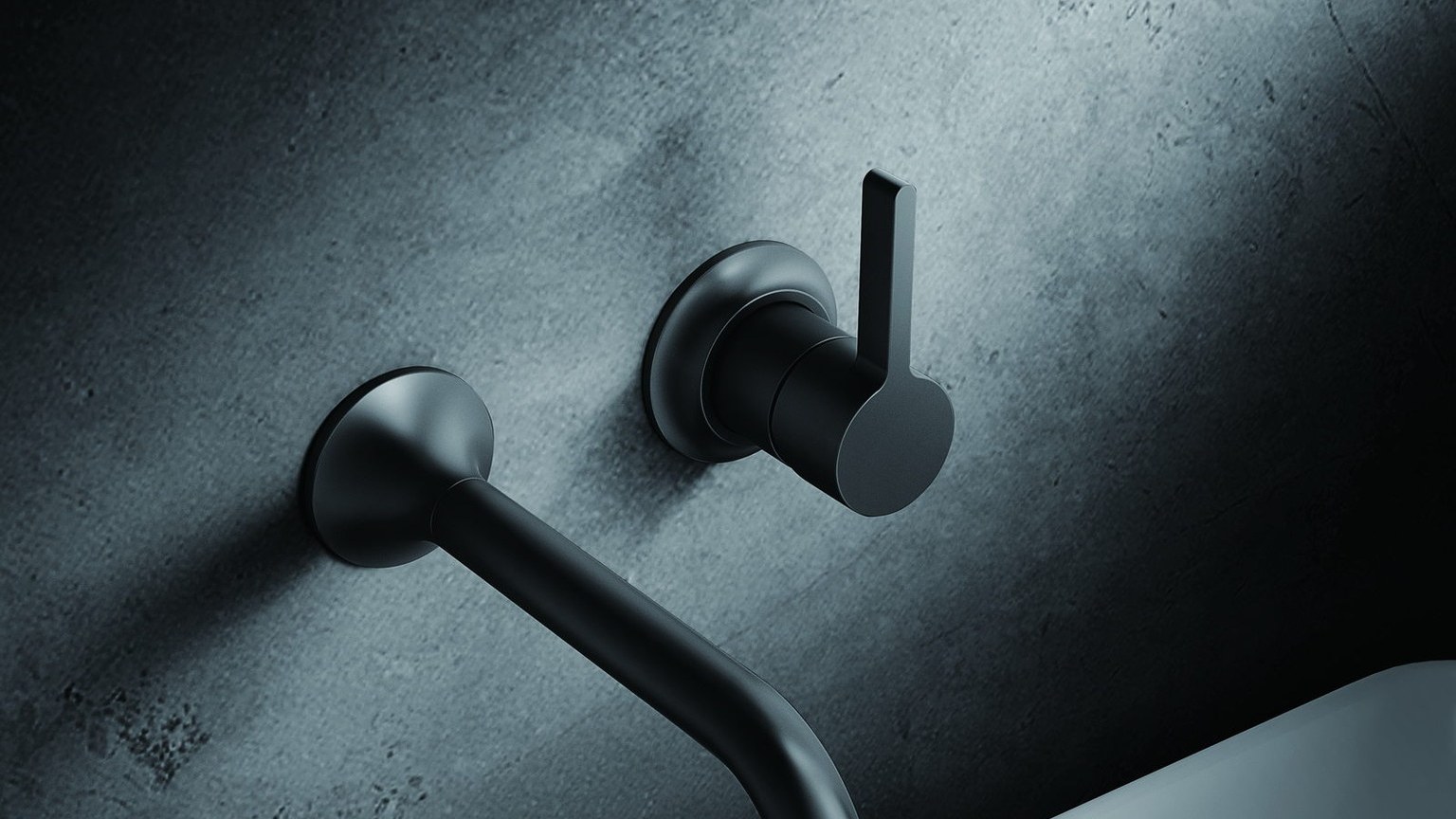 A black wall-mounted basin faucet above a basin
