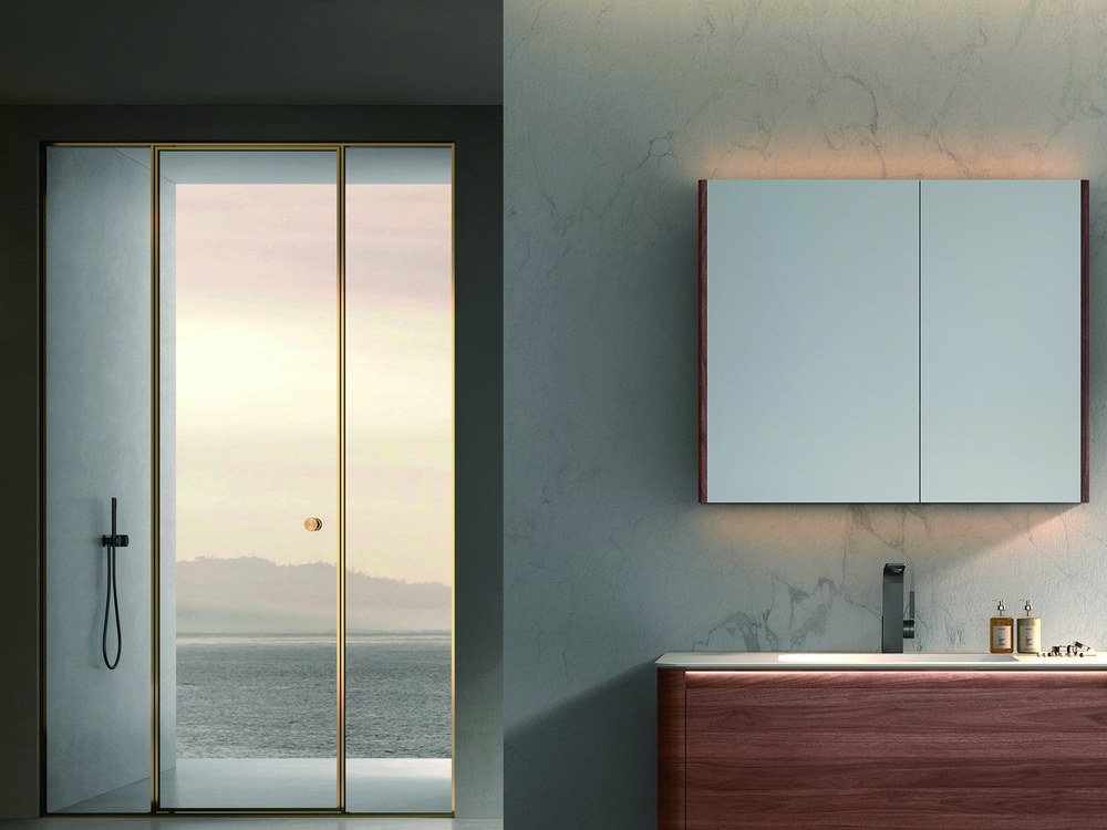 A bathing area with a mirror cabinet and shower fittings