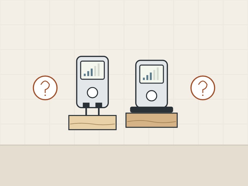 Illustration of a pin meter and a pinless meter, each on a board, between two question marks