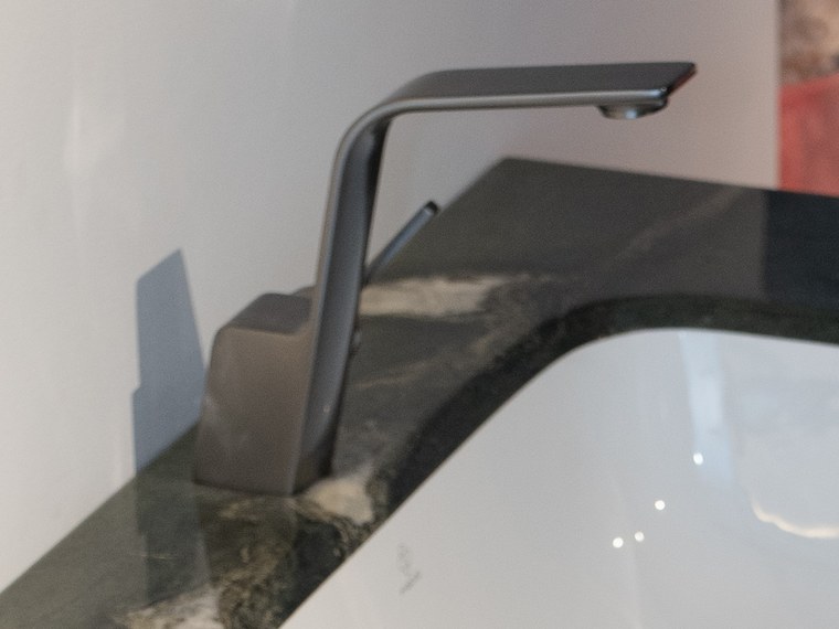 Brushed finish basin mixer on the stone worktop