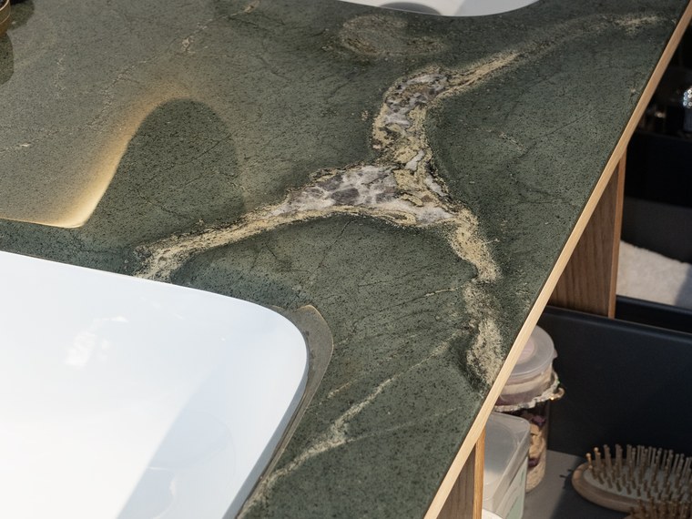 Natural veining across the green stone worktop