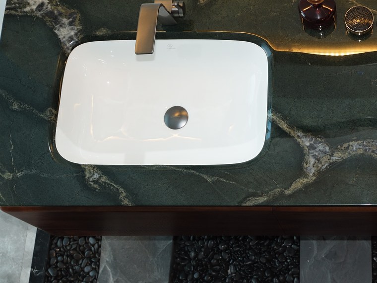 Under-mount basin set into the green stone worktop