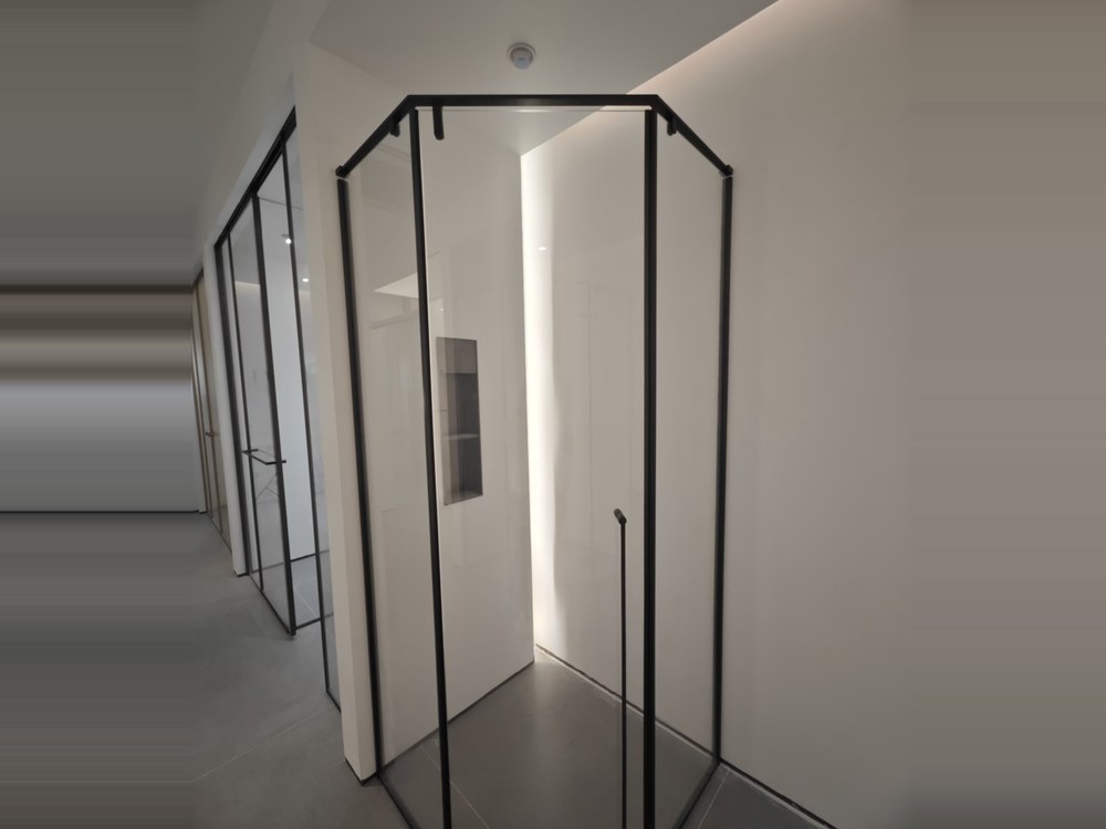Black-framed diamond corner shower enclosure in the WNS showroom