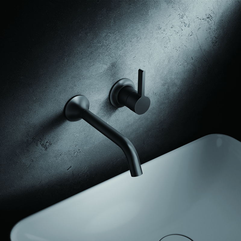 Wall-mounted basin faucet above a countertop basin