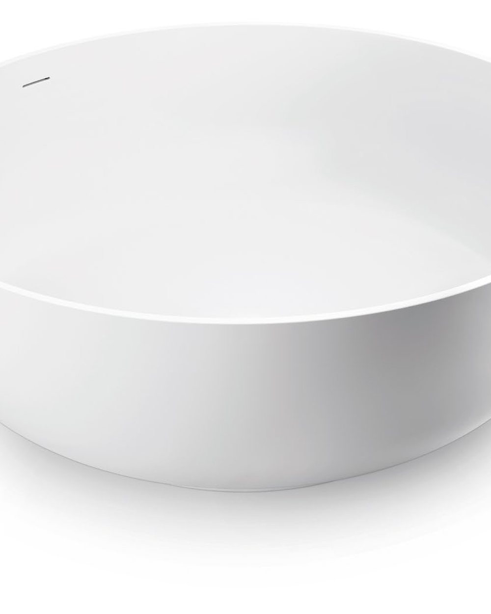 Round built-in solid surface tub set into a curved deck