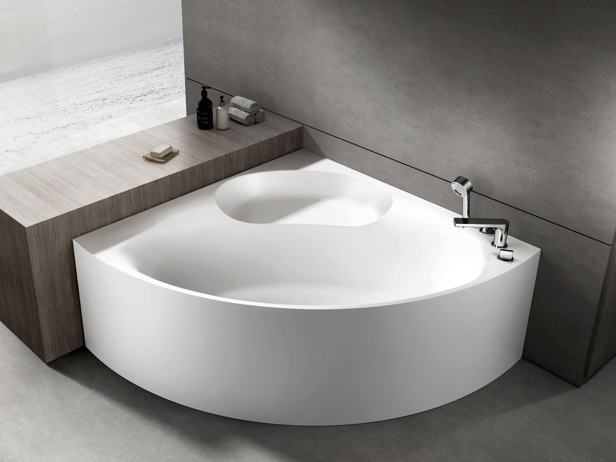 Round built-in solid surface tub set into a curved deck