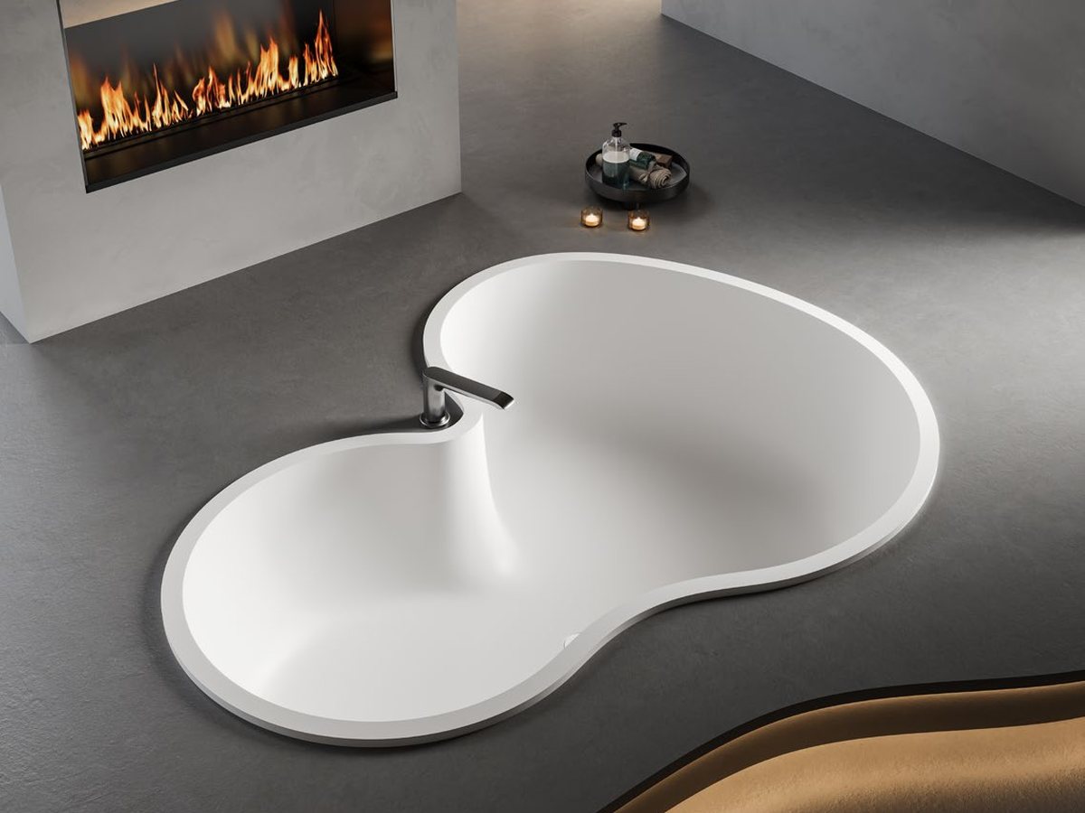 Round built-in solid surface tub set into a curved deck