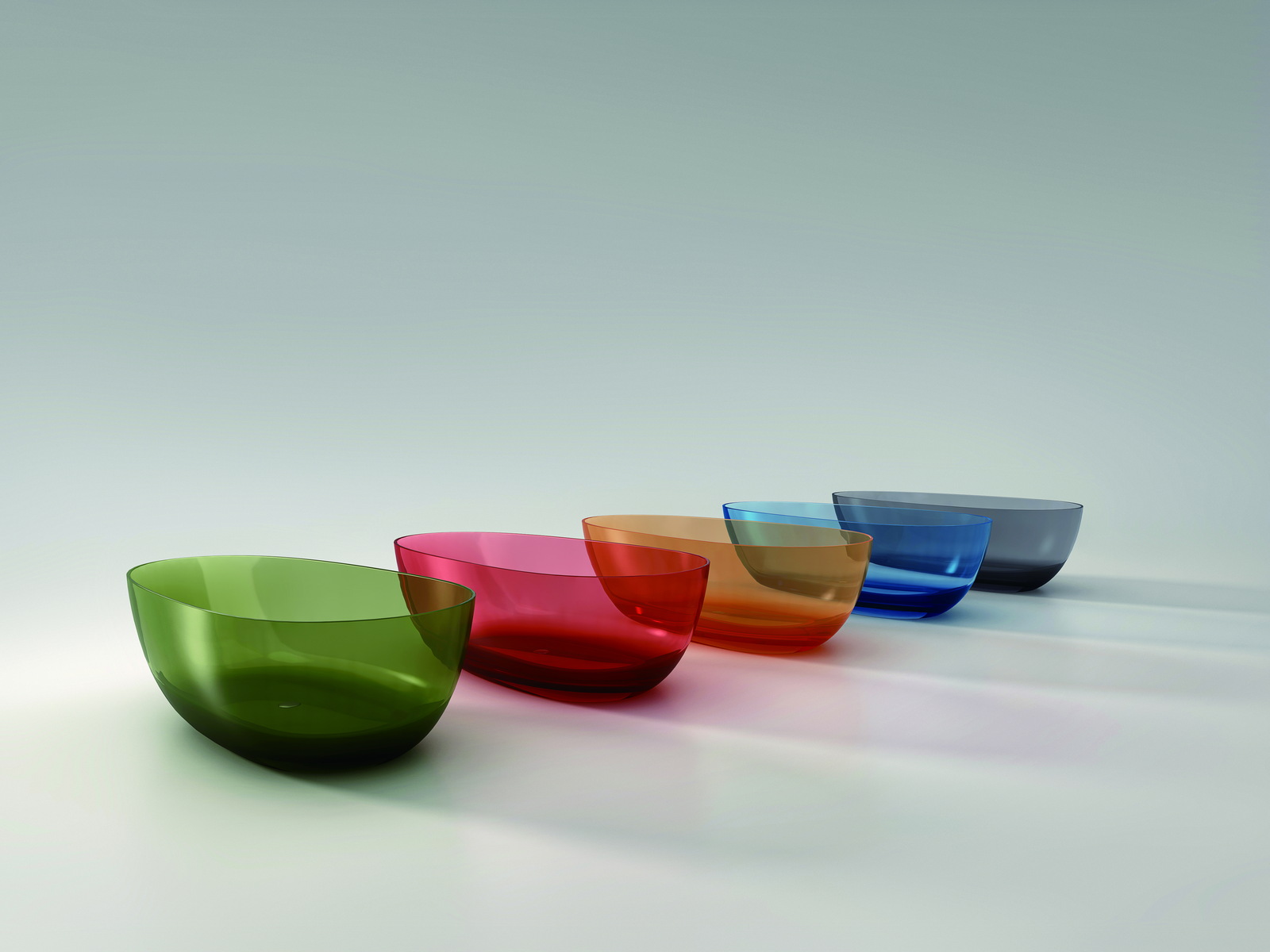 Countertop translucent basins shown in a range of colors