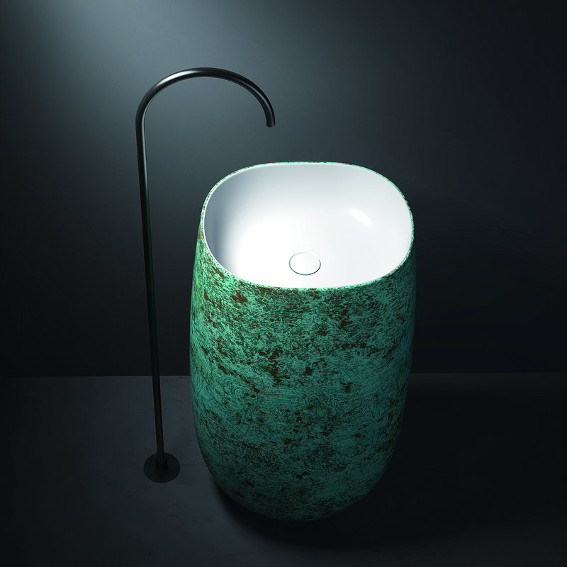 Green translucent basin shown against a plain wall