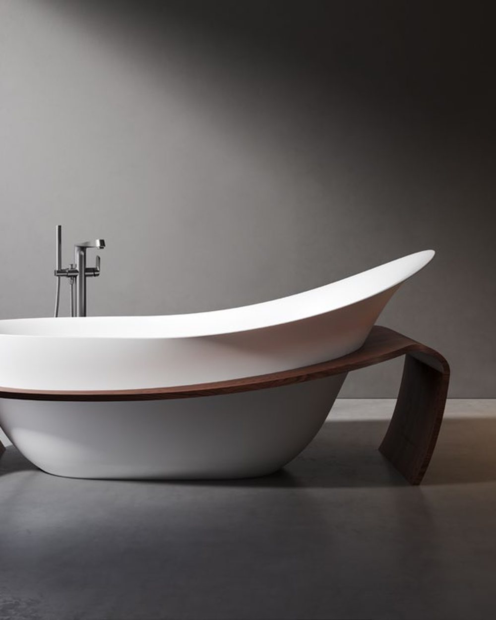 Compact upright soaking tub with floor-standing filler and stool
