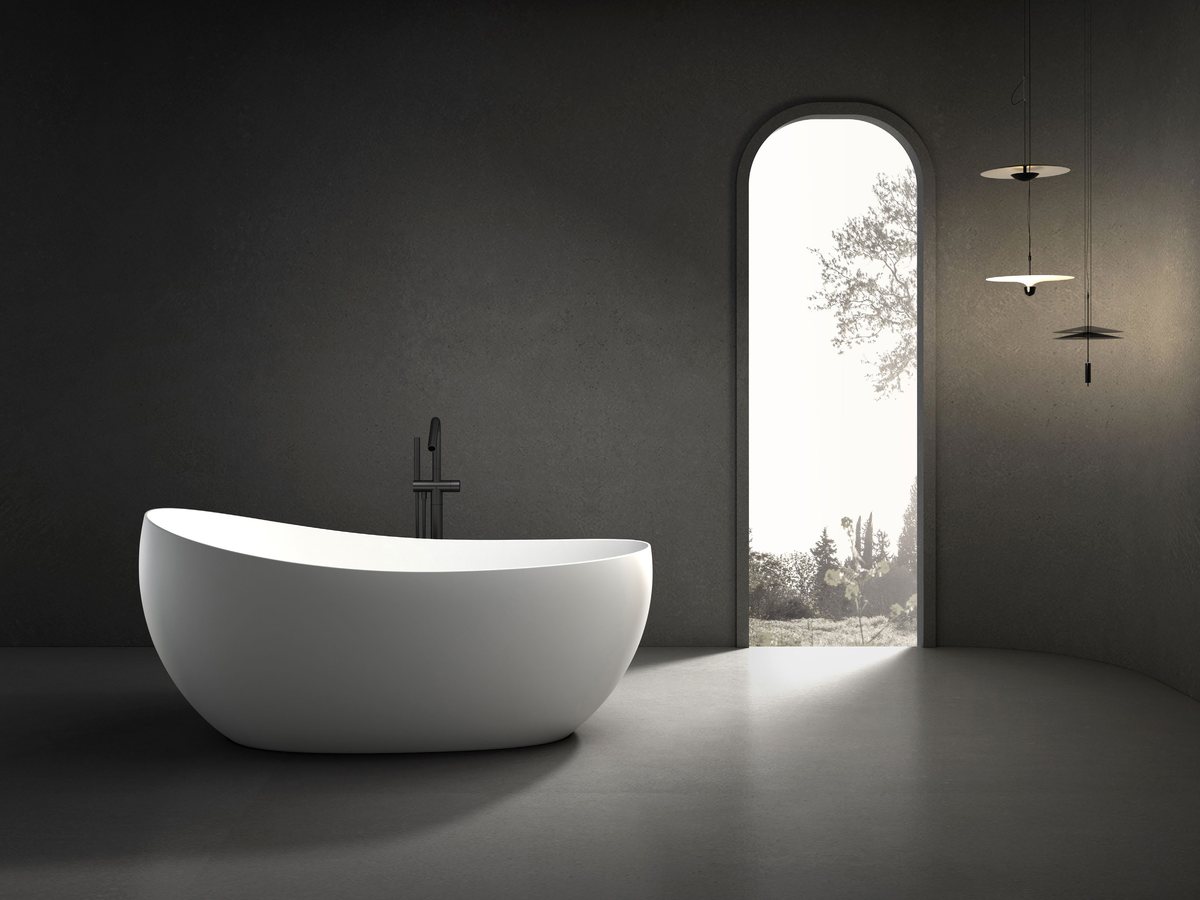 Compact oval soaking tub on a stone platform