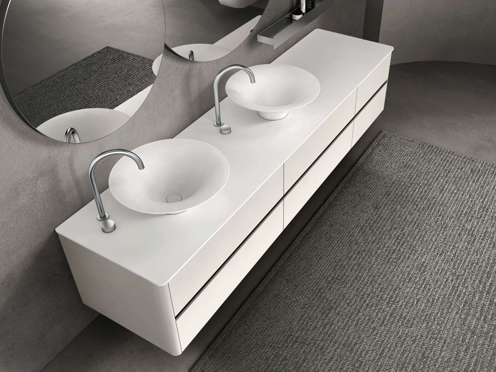 Twin countertop basins set into a long vanity top