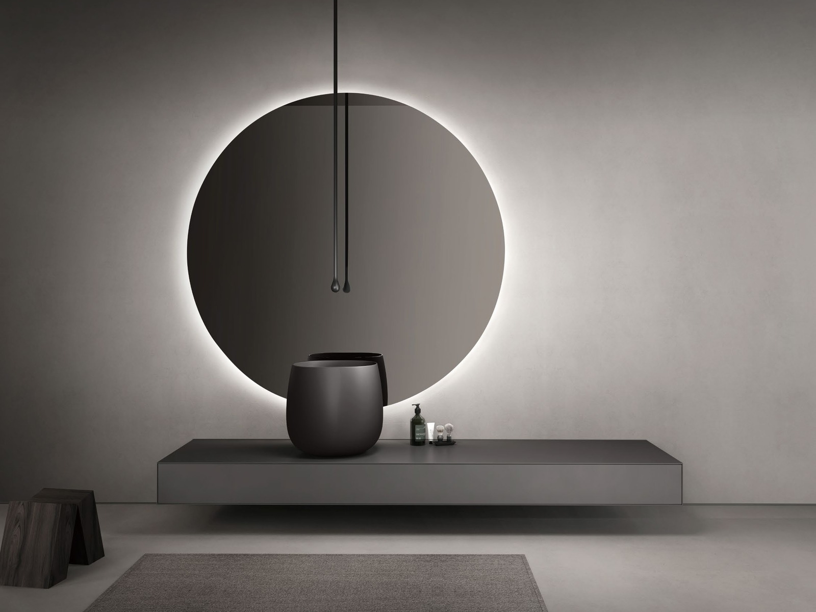 Round vessel basin placed on a stone-look vanity top