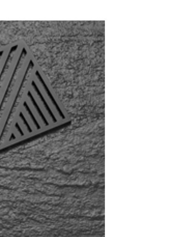 Stainless floor drain grate shown in close detail
