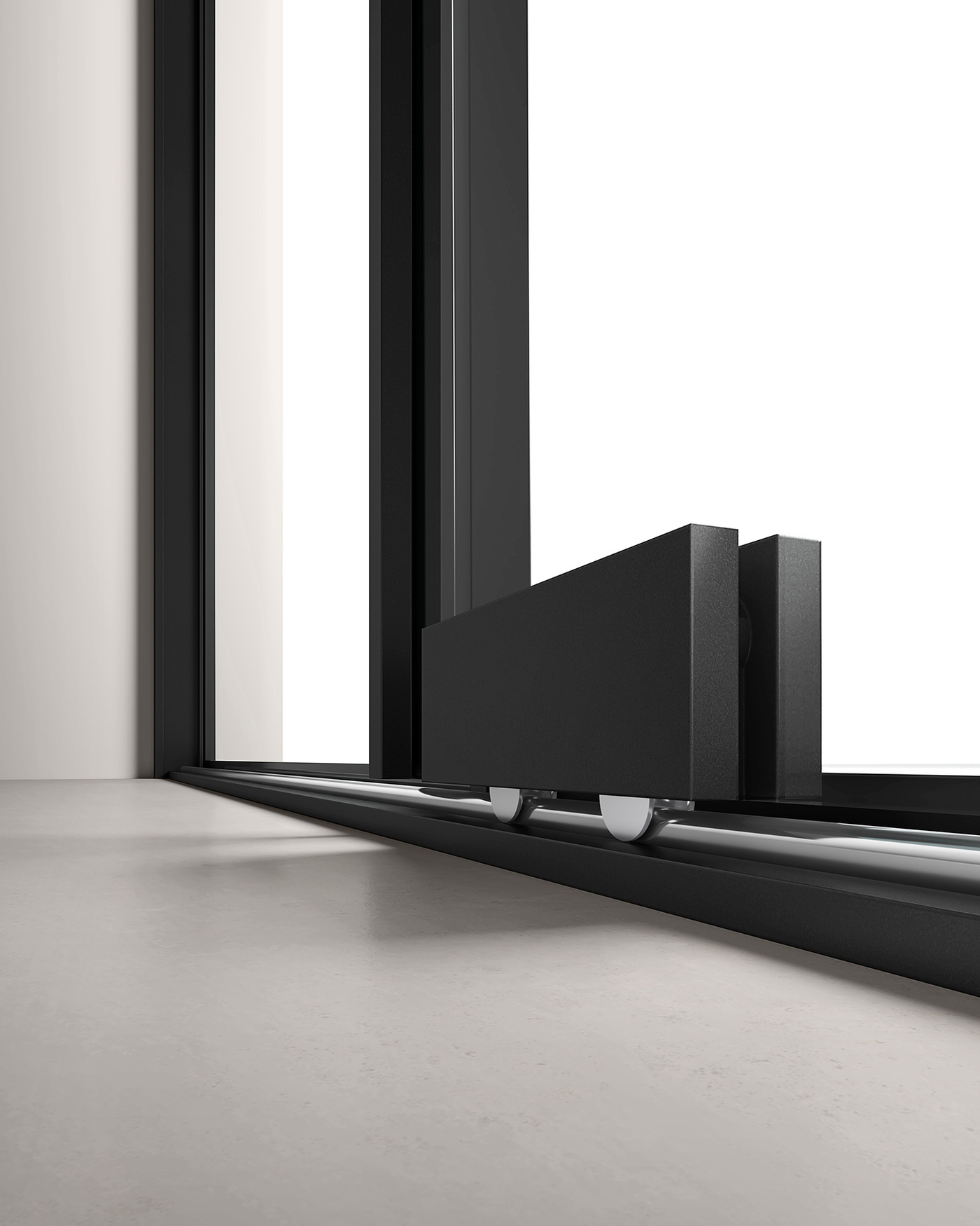Bottom track and roller detail of a black frameless sliding shower door