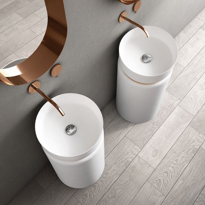 Slim column basin in a compact guest bathroom