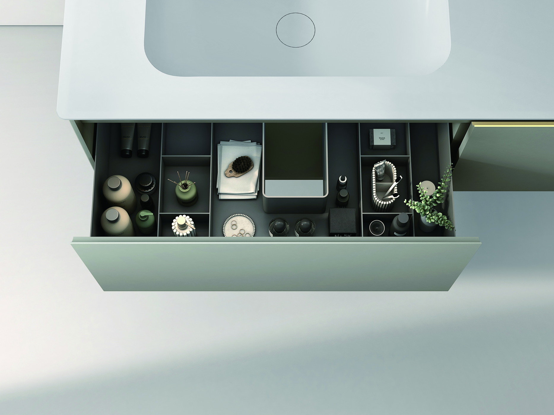 An open vanity drawer with divided compartments