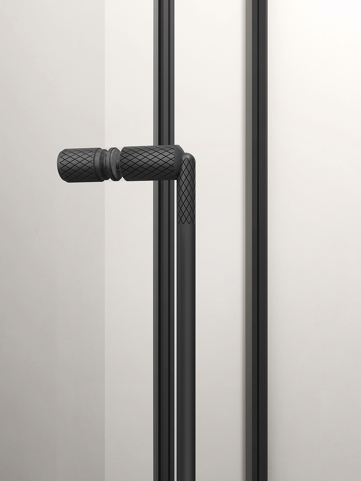 Matt black vertical handle of a shower door