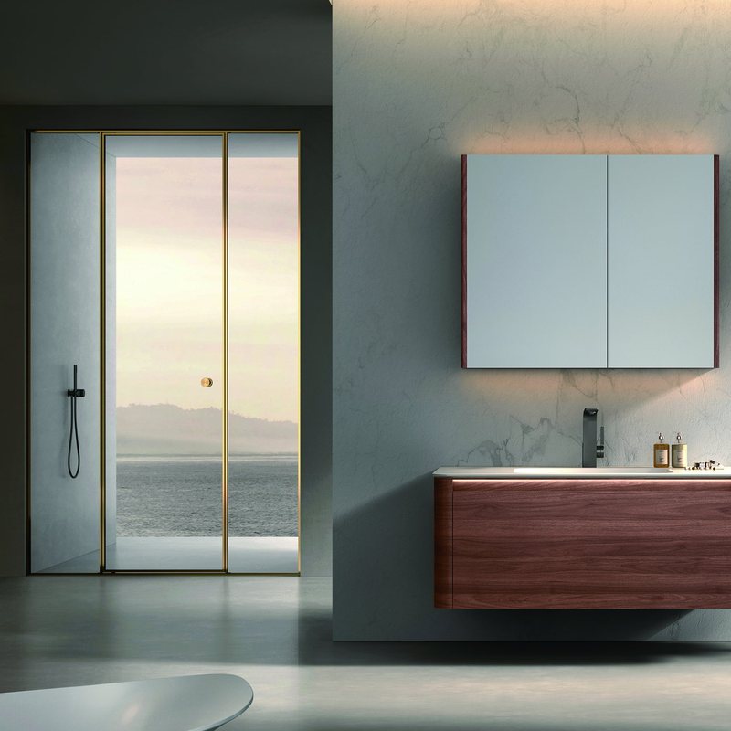 A bathing area with a mirror cabinet and shower fittings