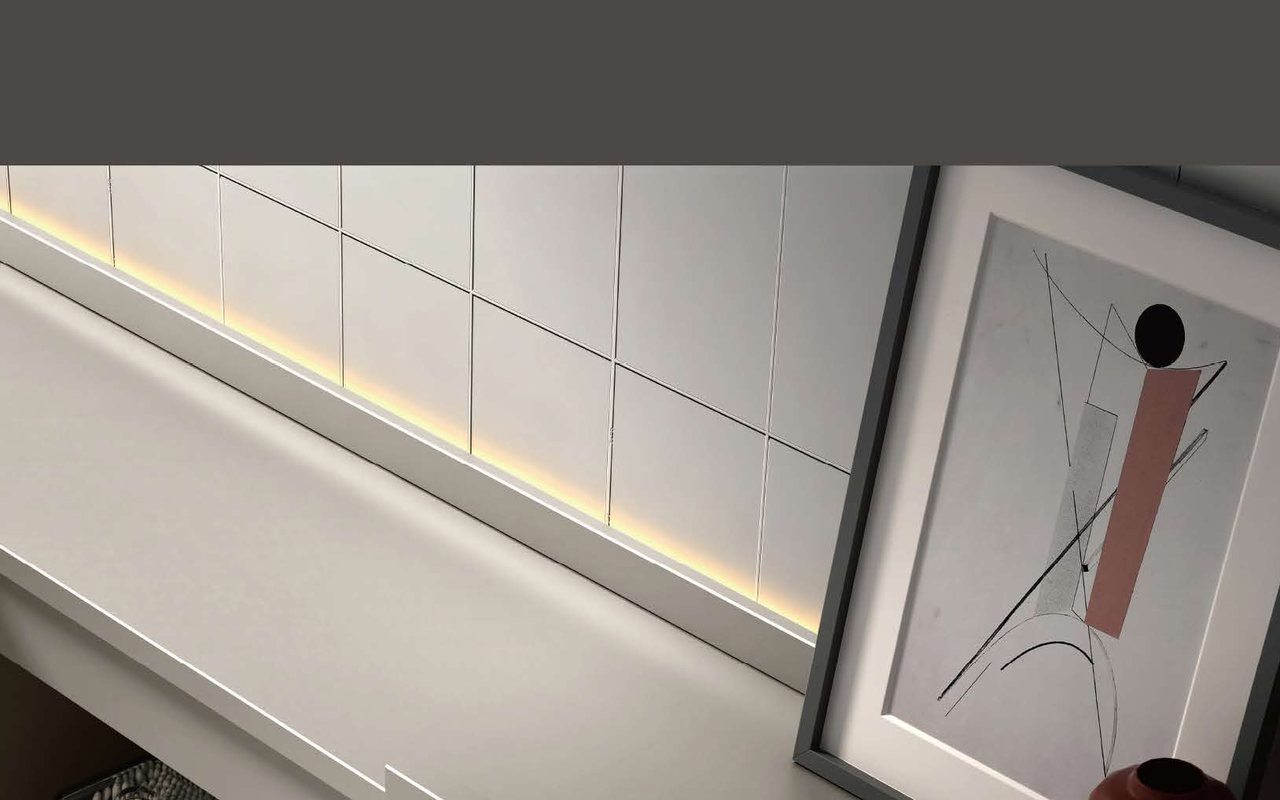 Buyer reviewing wall-mounted vanity drawings and finish samples