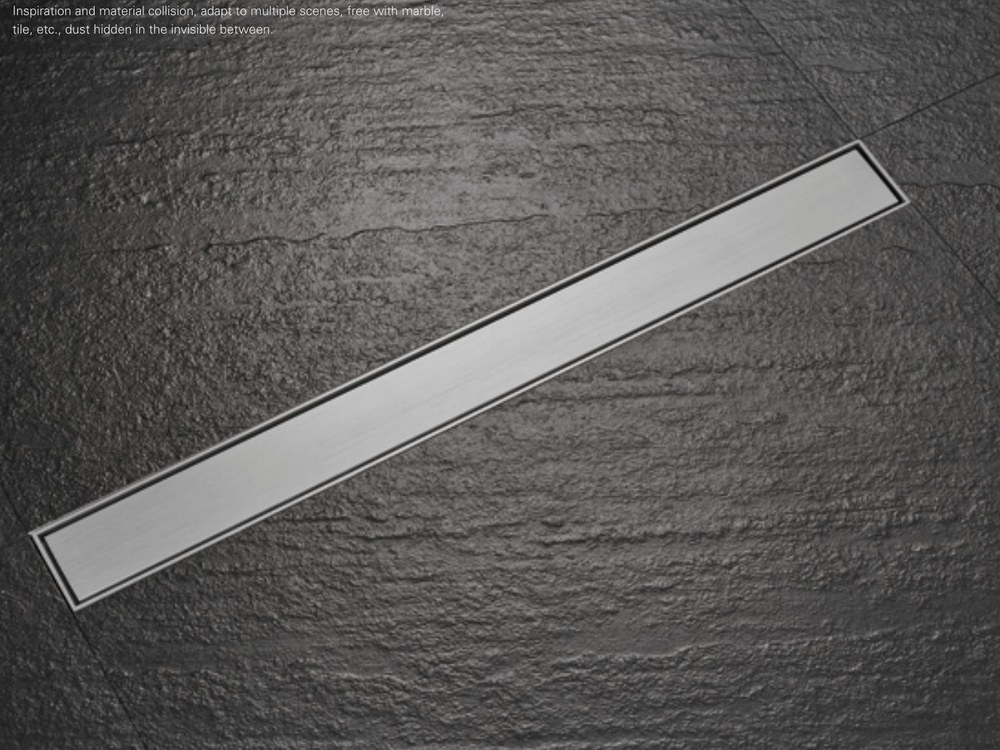 Brushed stainless linear invisible floor drain set into slate tiling